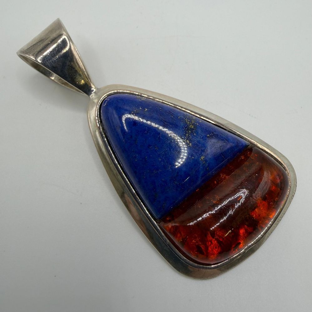 Lot 303: DTR Desert Rose Trading Lapis and Amber Resin Sterling Silver Pendant AB40