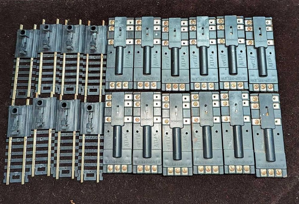 Lot 212: Box Of Atlas HO Code 100 Bumpers & Atlas Snap Relays