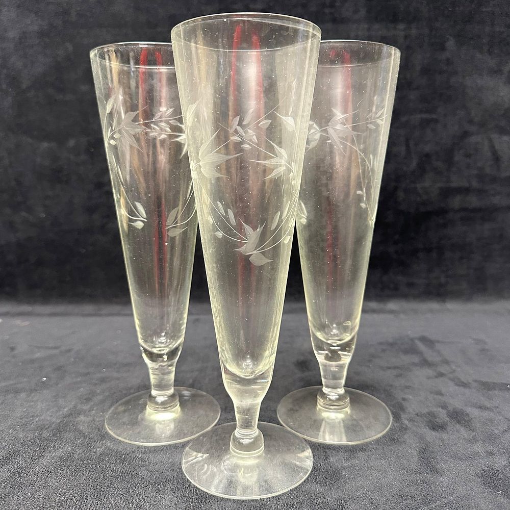 Lot 220: Set of Three Etched Glass Champagne Flutes with Floral Vine Motif Unmarked