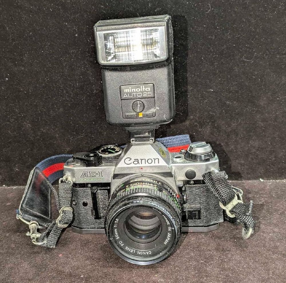 Lot 246: Vintage Canon AE-1 Program FD 35mm Film Camera With Minolta Flash