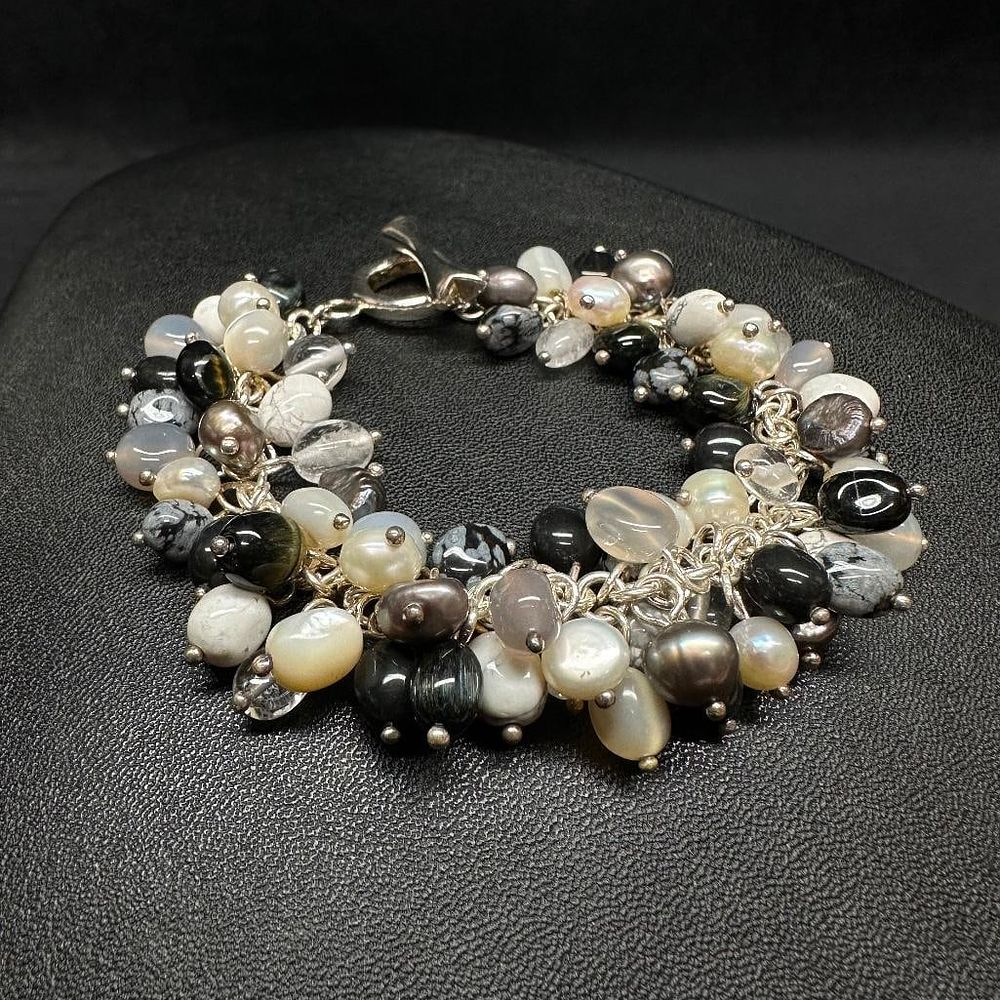 Lot 283: Sterling Silver Black, White, & Grey Stone Bead Bracelet
