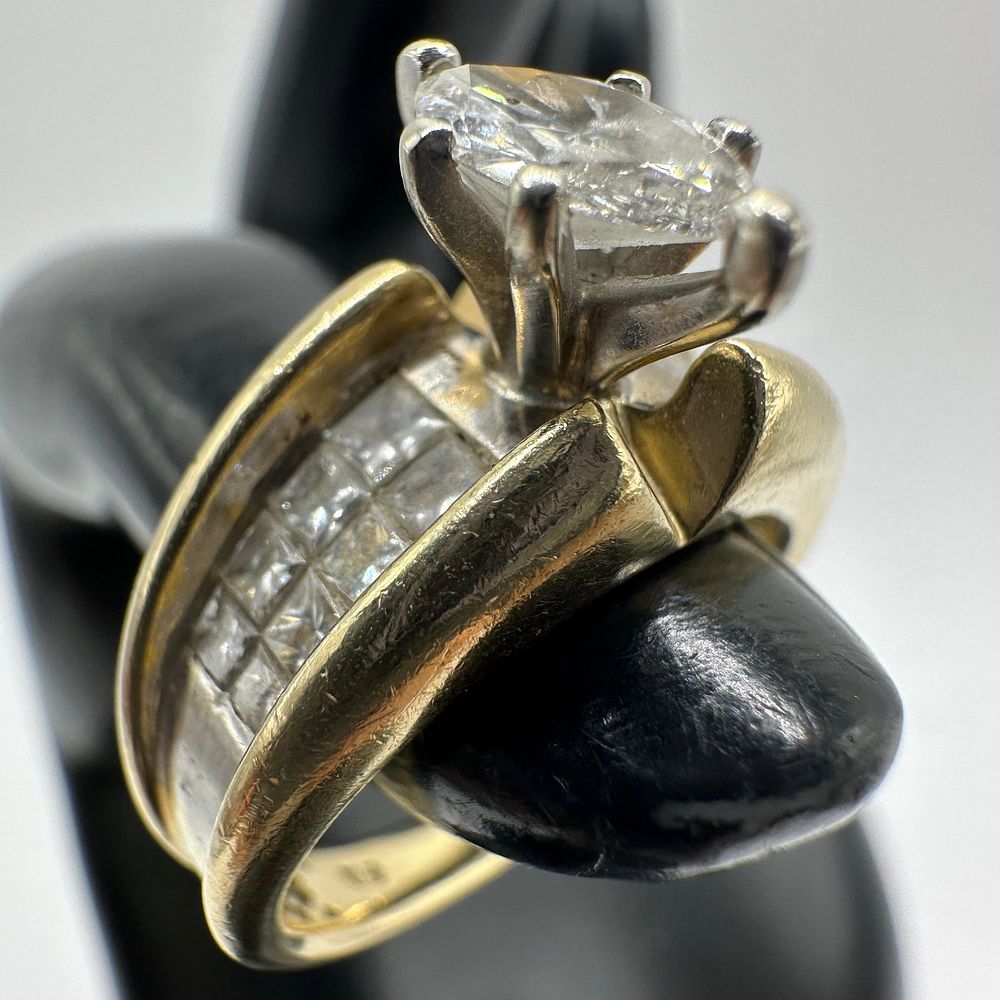 Lot 394: Central Marquise Cut Moissanite Channel Set 14K Gold Ring