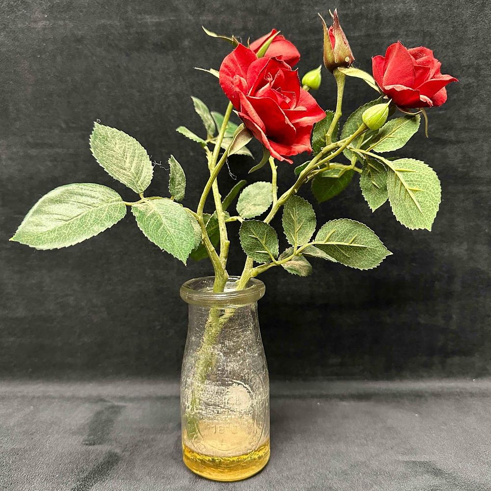 Lot 179: Dairy Milk By Heritage Company Half Pint Bottle Since 1810 Pebbled Glass with Faux Flowers