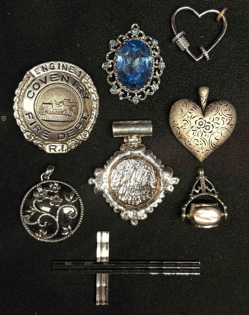Lot 339: 8pc Silvertone Charms and  Pendants Collection