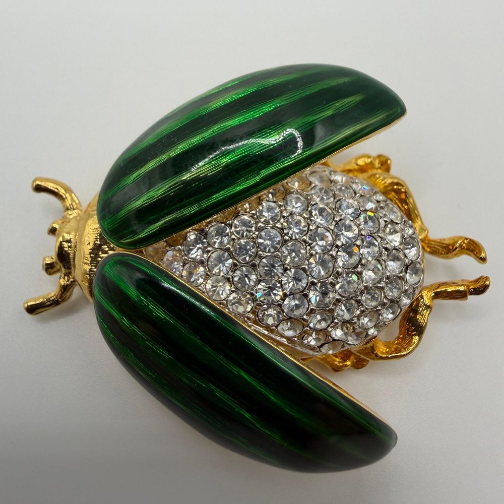 Lot 173: Kenneth Jay Lane KJL Green Enamel and Crystal Beetle Insect Brooch