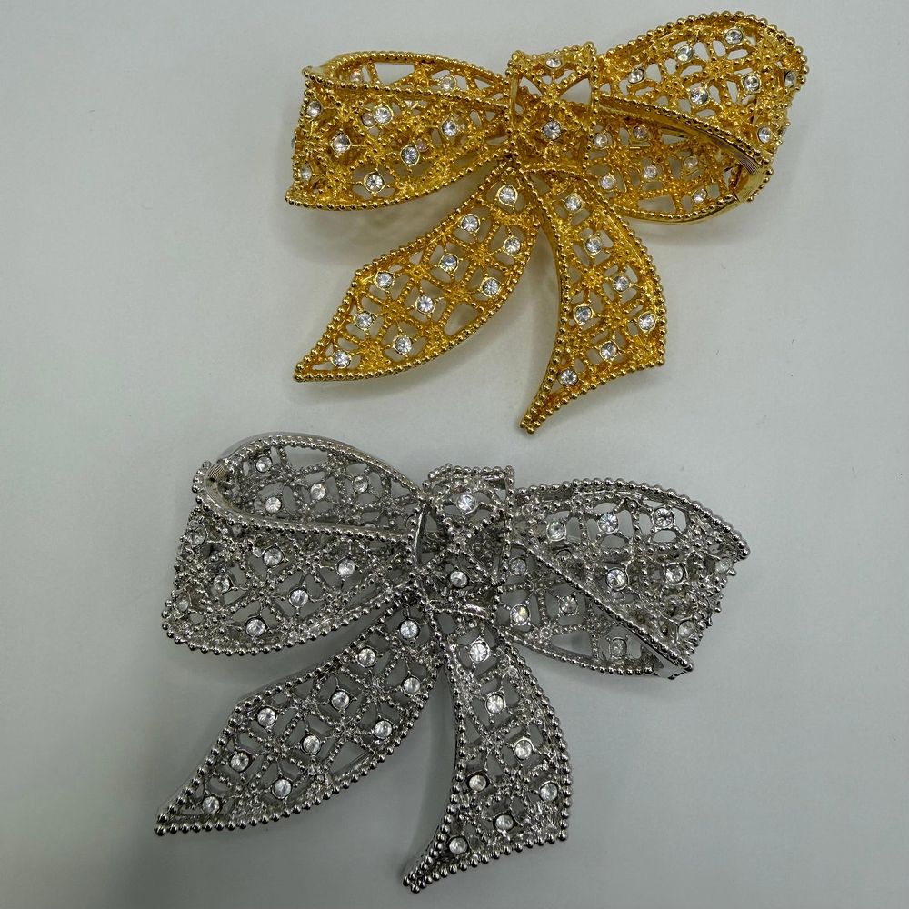 Lot 188: Kenneth Jay Lane Pair of Rhinestone Bow Brooches Gold and Silver Tone KJL