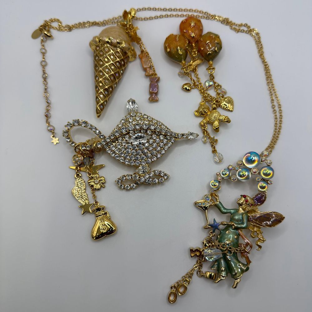 Lot 217: Kirks Folly Fantasy Jewelry Group Fairy Necklace Genie Lamp Ice Cream Cone Brooch