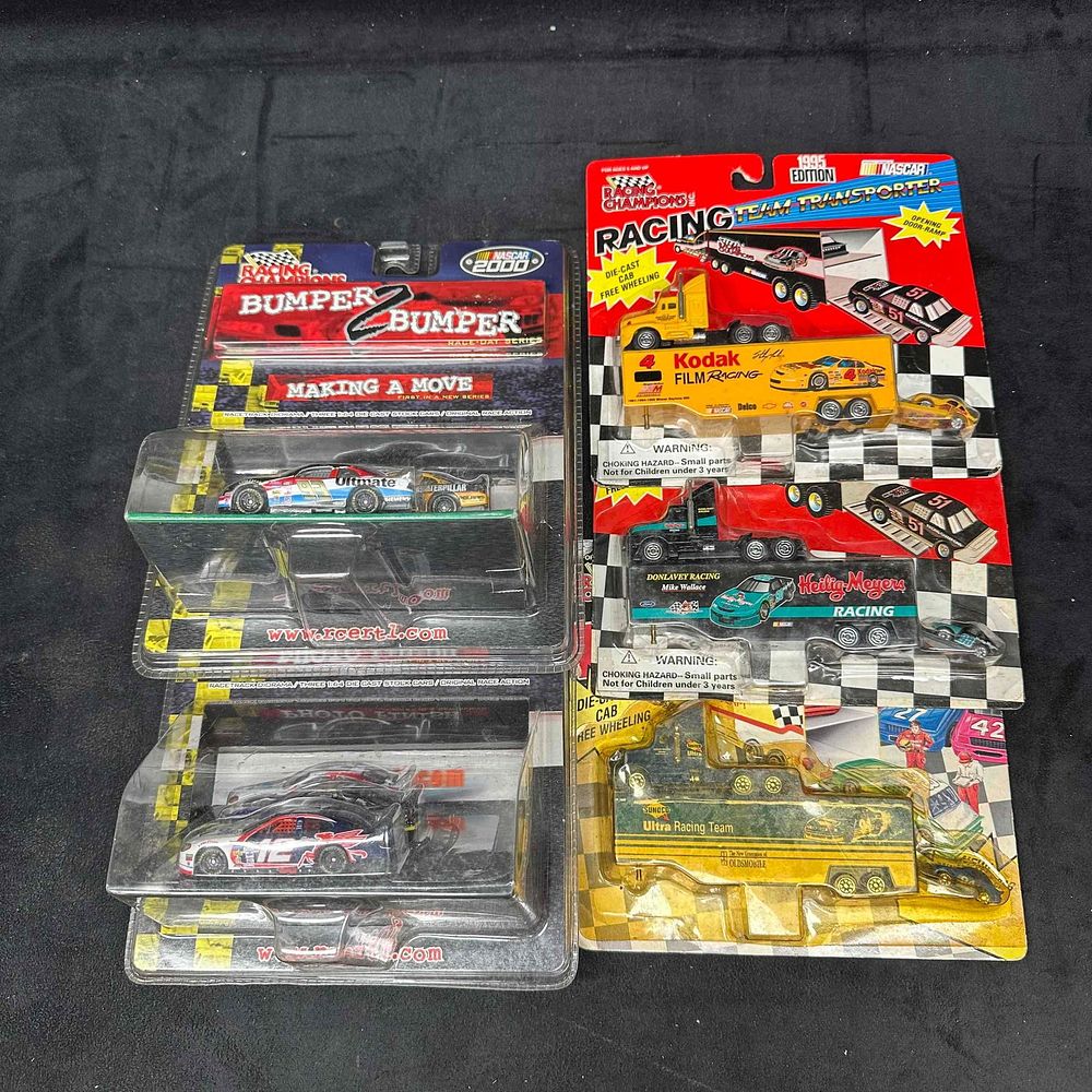Lot 272: Racing Champions NASCAR Diecast Car Lot Bumper to Bumper Sets and Transporters 1990's