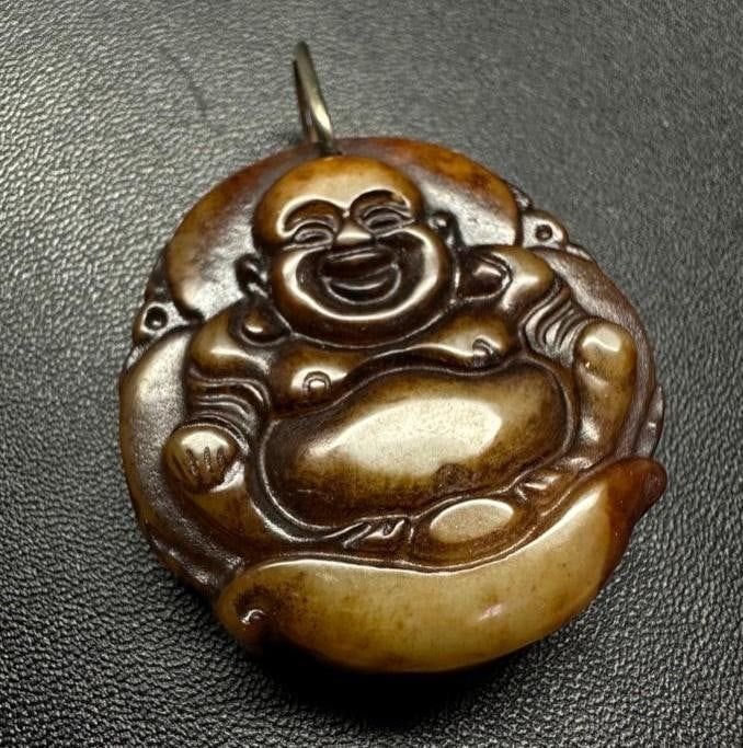 Lot 302: Brown Jade Buddha Pendant