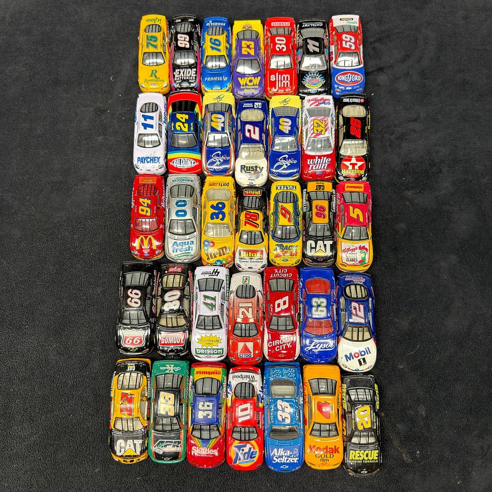 Lot 398: Large Assortment of 35 NASCAR 1:24 Scale Die-Cast Stock Cars