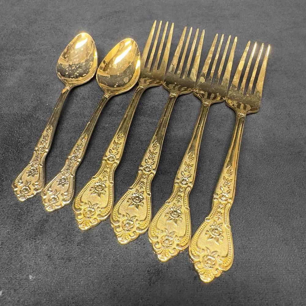 Lot 470: Rogers Gold Tone Stainless Floral Royalty Design Set Forks and Spoons