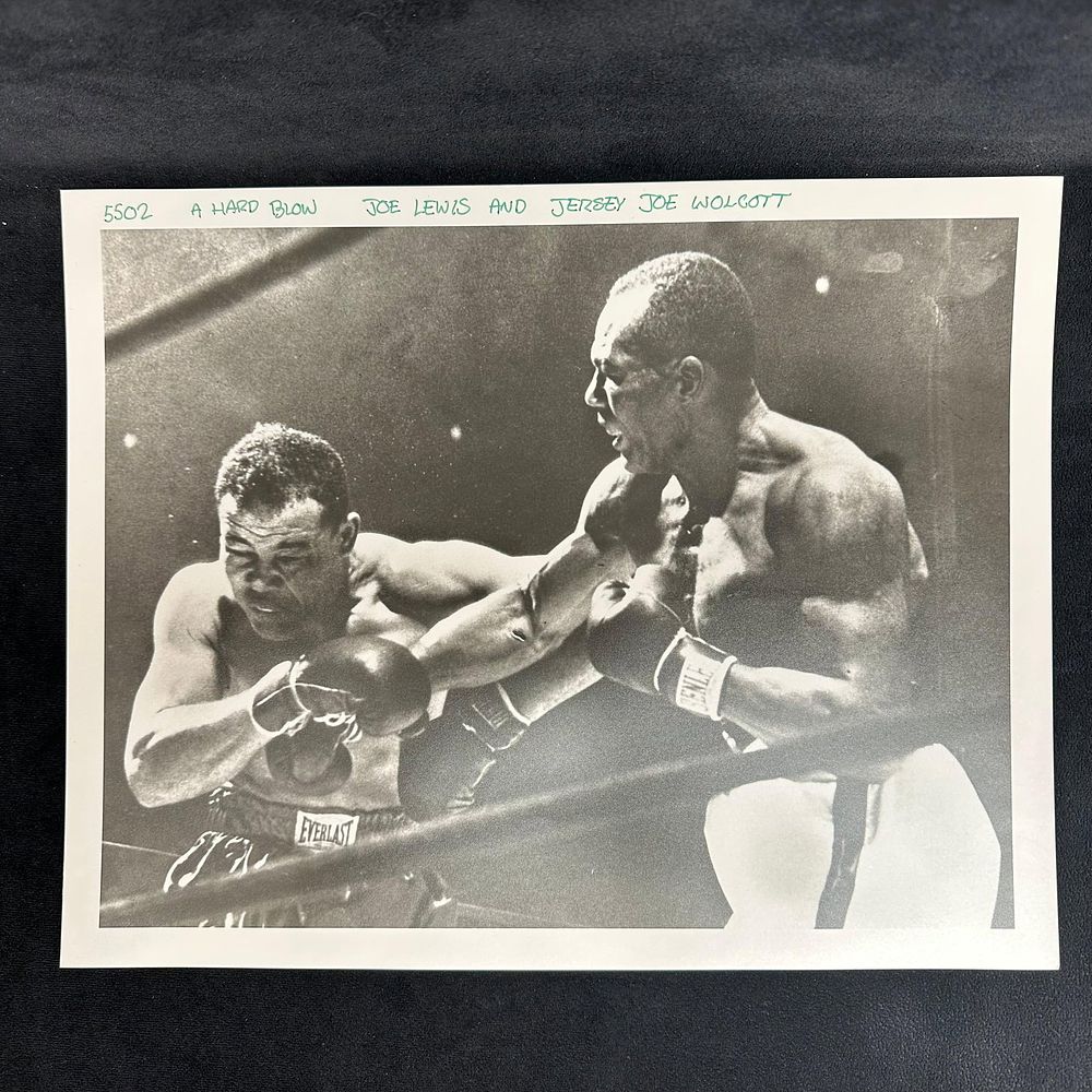 Lot 471: Boxing Action Analog Photograph Joe Louis and Jersey Wolcott A Hard Blow