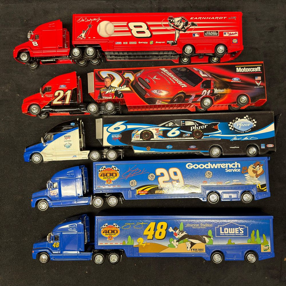 Lot 494: NASCAR Die-Cast Transporter Trucks Earnhardt Jr Elliott Martin and Johnson Five Pcs