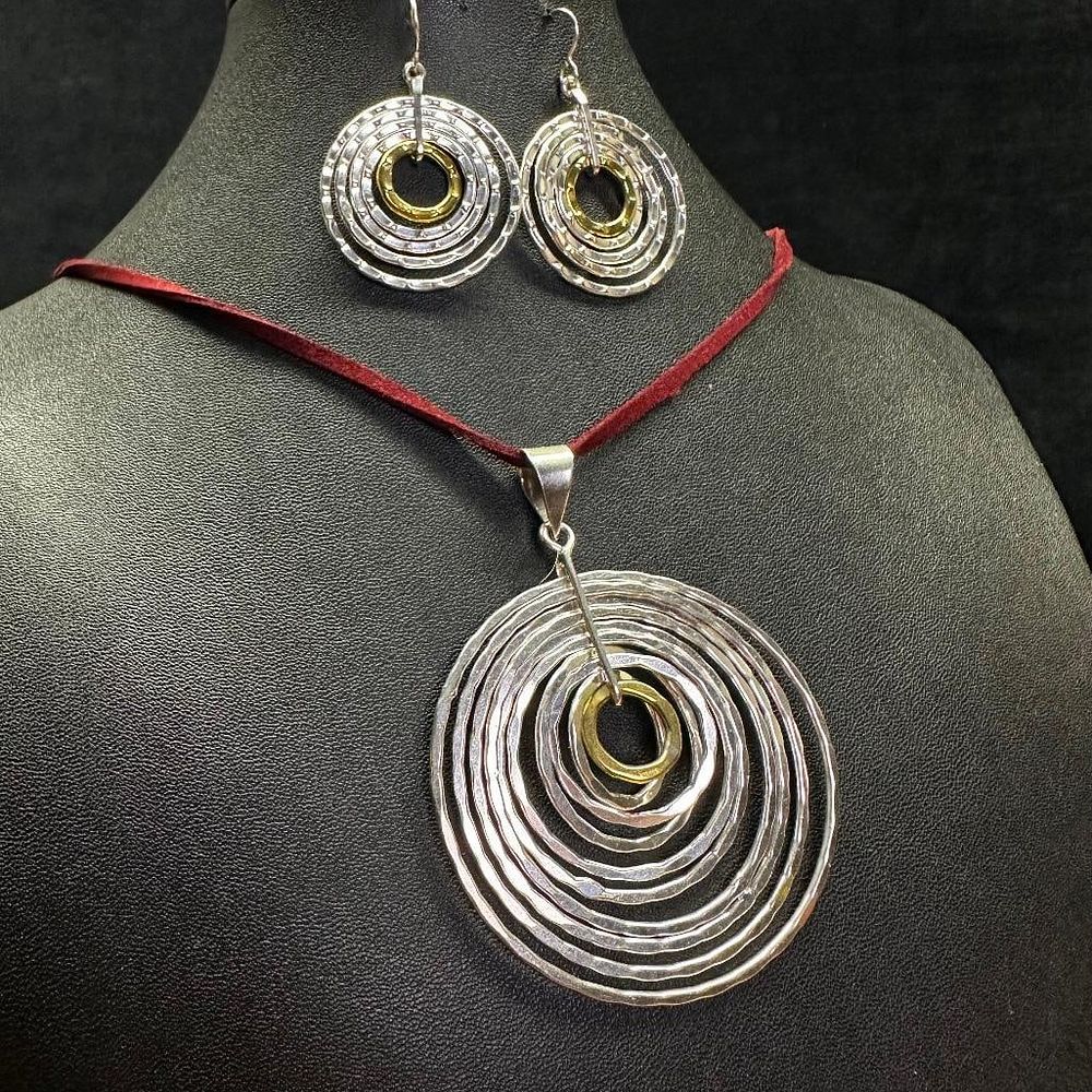 Lot 488: Sterling Silver and Brass Concentric Ring Necklace and Earrings