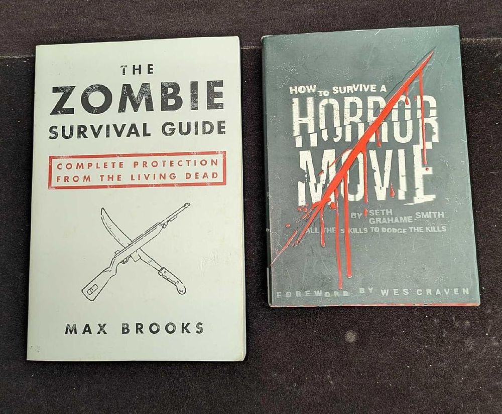 Lot 269: Zombie Survival Guide And How To Survive A Horror Movie Paperback Books