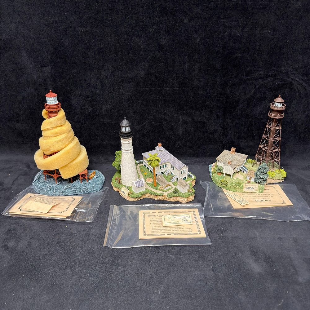 Lot 354: Harbour Lights 3 Florida Landmarks American Shoal Key West and Sanibel Landscape Figures