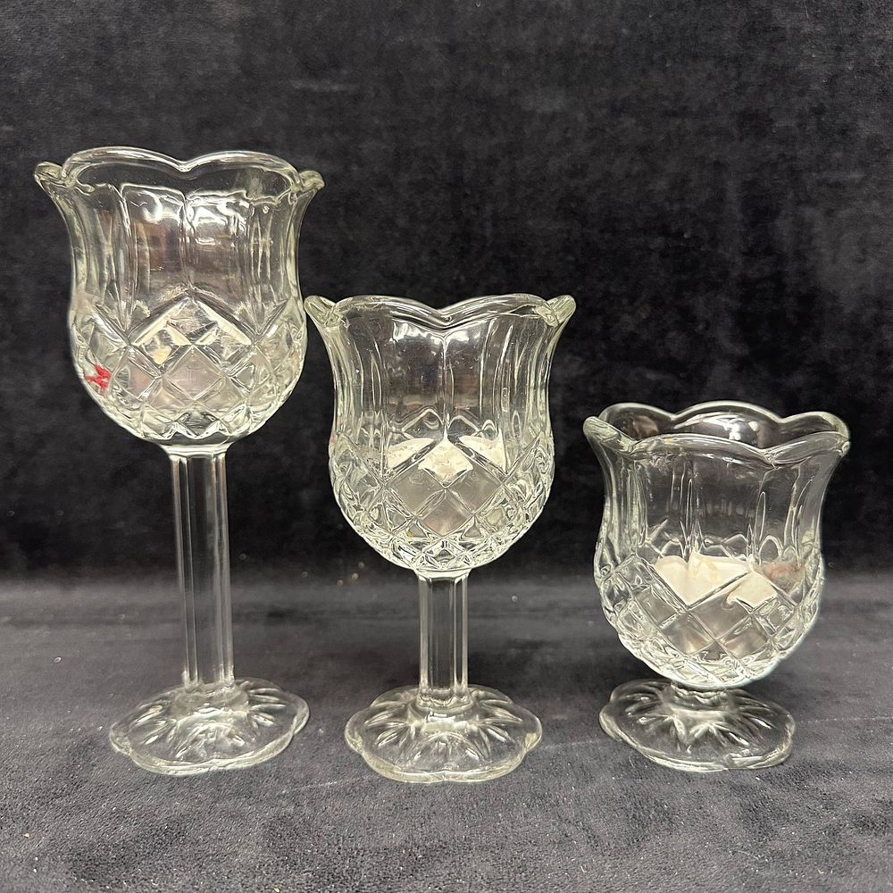Lot 495: Set of Three Clear Pressed Glass Tulip Form Candle Holders