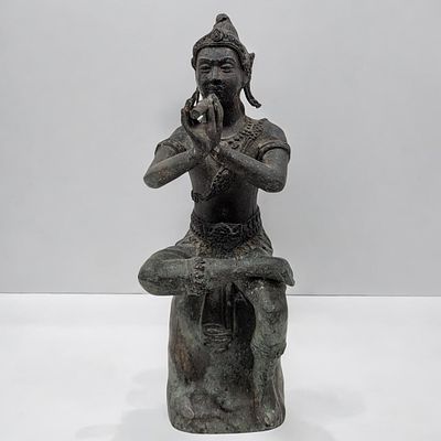 Southeast Asian Bronze "Krishna" With Flute Seated Figure. Measures approx. 9 1/4" X 3 1/2". 