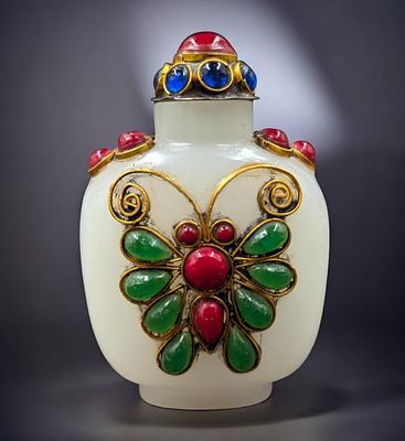 Chinese Carved Jade Snuff Bottle With Precious Gems And A Gilt Butterfly Pattern. Measures 