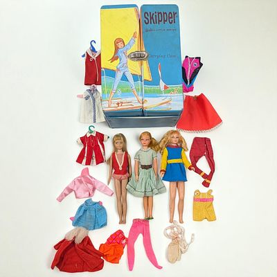 Vintage Mattel Skipper Case With Three Skipper Dolls And Assorted Clothing. Each doll has an 