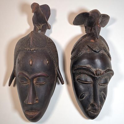 Pair Of Wood Carved African Baule Or Guro Masks With Bird. Measures approx. 16.5" X 7" X 5" and 
