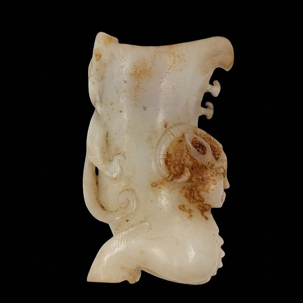 A Carved Chinese White And Russet Jade Mythical Creature Sculpture. Measures approx. 4 1/2" X 