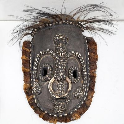 Large Papua New Guinea Iatmul Sepik Region Carved Wood Mask With Shells, Tusks, And Feathers. 