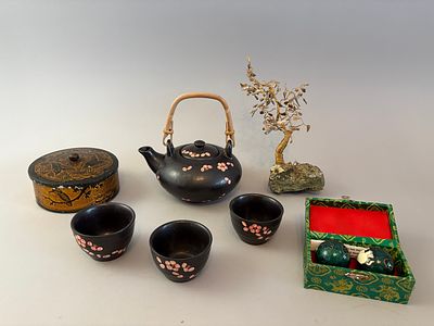 A Collection of East Asian Decorative Objects. This lot comprises of a black matte ceramic 