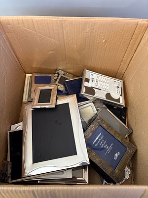 A Collection of Contemporary Silver-Plated and Other Metallic Photo Frames and Albums. Job lot 