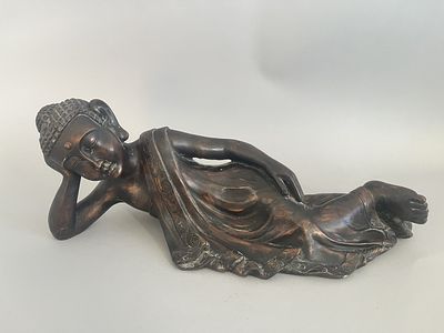 A Resin Reclining Buddha Figure with Dark Bronze-Tone Finish. A resin figure of a reclining 