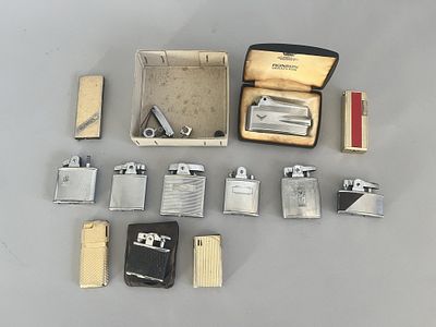 A collection of twelve vintage lighters, by Ronson. One is labeled "RONSON VARAFLAME." The 