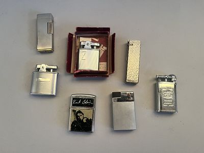 A collection of seven assorted vintage to modern metal cigarette lighters, predominantly 