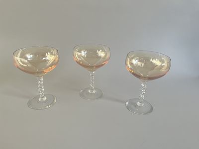 A set of three vintage aperitif/cordial glasses. Each glass features a wide, shallow bowl with 