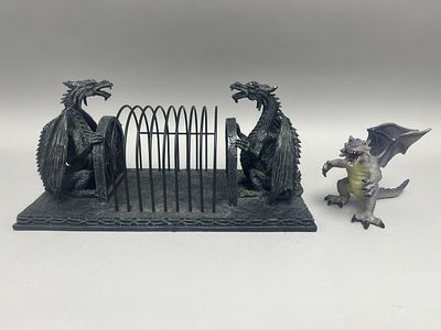 A dark grey/black dragon-themed letter/mail organizer, 36 cm long, with one small light 