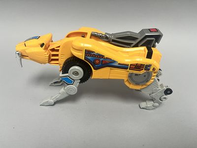 A Mighty Morphin Power Rangers Sabertooth 1990'S Tiger Zord. This modern plastic transforming 