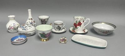 A collection of eleven pieces of fine bone china and porcelain decorative wares, primarily 
