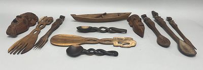 A collection of vintage hand-carved wooden objects, predominantly featuring an assortment of 