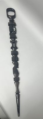 A Carved African Hardwood Ceremonial Staff, A long, intricately carved staff or ceremonial 