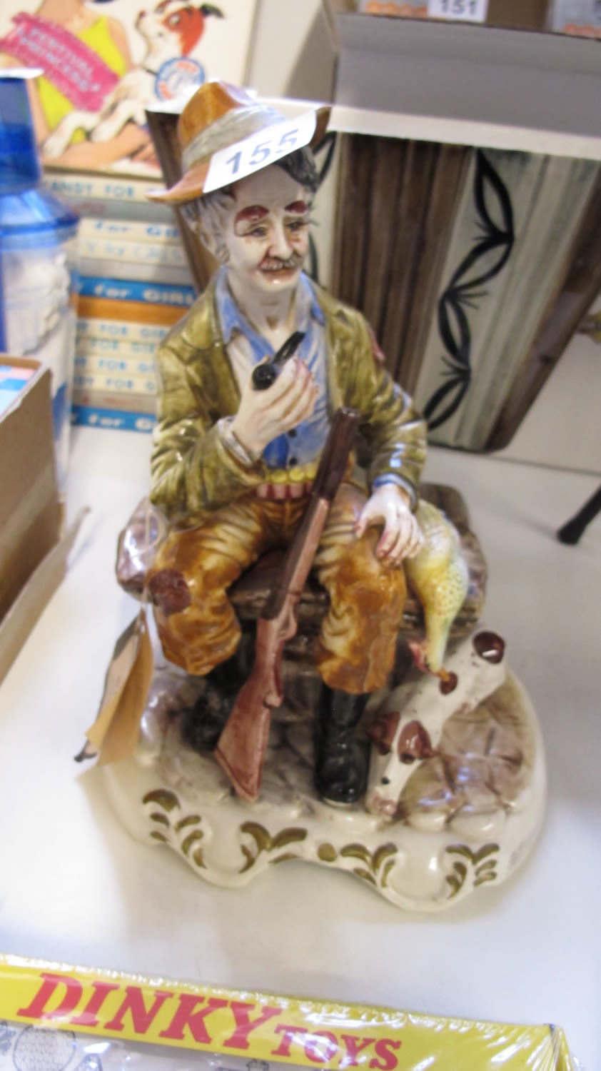 Lot 155: large ceramic Capodimonte hunter and dog figurine