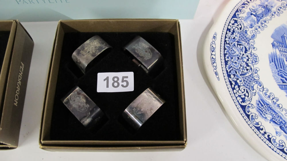 Lot 185: engraved silver plated Pendragon napkin rings x 4