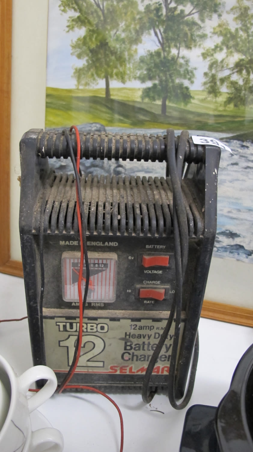 Lot 391: multi volt battery charger. AF: needs a clamp