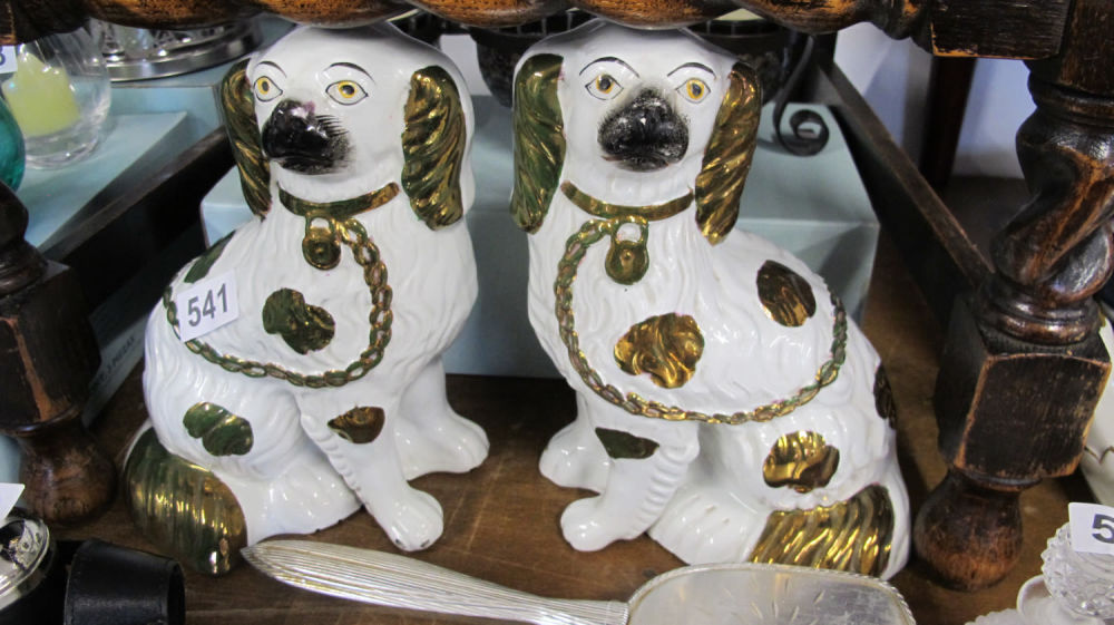 Lot 541: pair of mini Staffordshire dogs