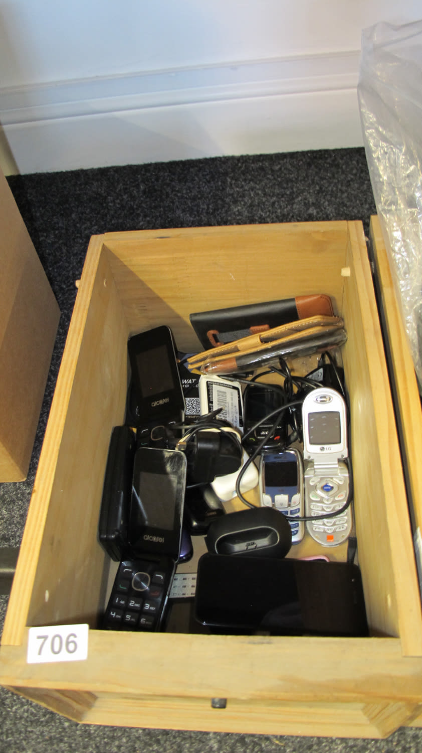Lot 706: drawer of old mobile phones and accessories