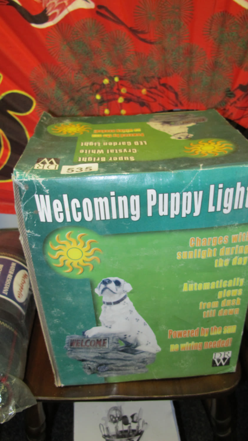 Lot 535: Solar powered welcoming puppy light