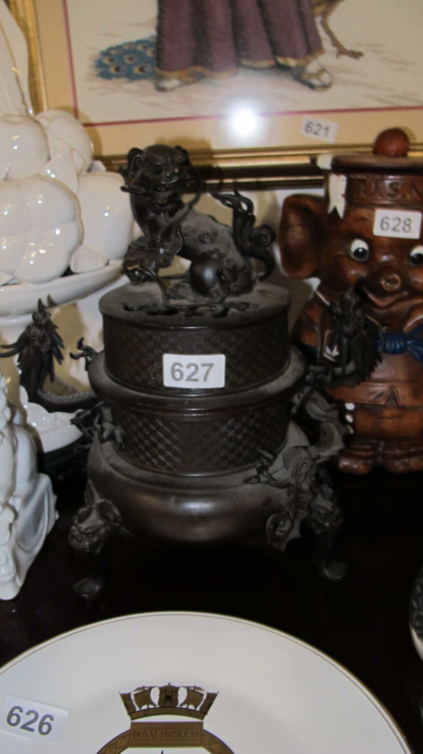 Lot 627: Bronze foo dog and dragon censor