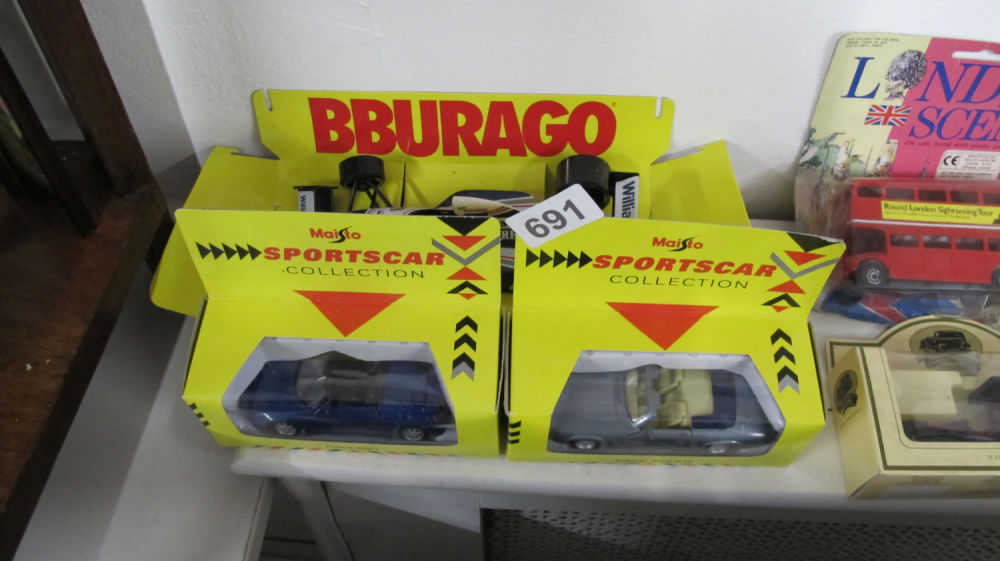 Lot 691: 2 boxed Maisio cars and one Bburaggo