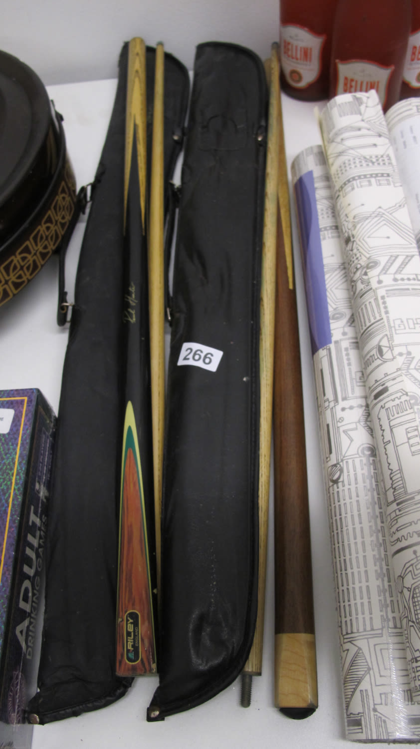 Lot 266: 2 snooker cues. One is a Riley signed...