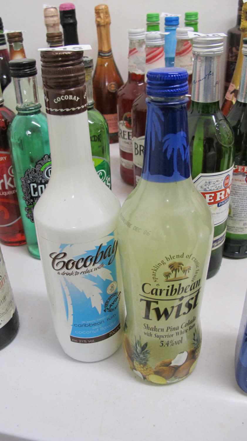 Lot 315: 2 Bottles of coconut licquer and mixed pina...