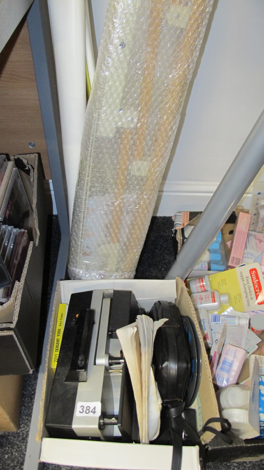 Lot 384: Vintage projector with screen and films