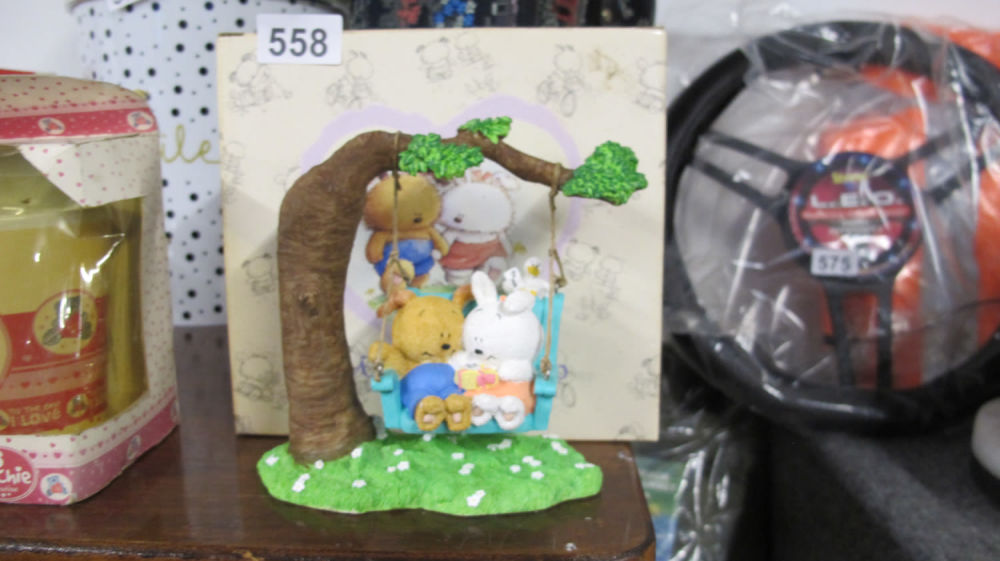 Lot 558: Super cute new ornament. They're on a swing. 